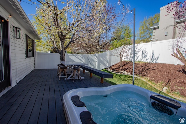 64 Winding Way, Logan, UT 84321 - wooden deck with a fenced backyard, a hot tub, and outdoor dining space