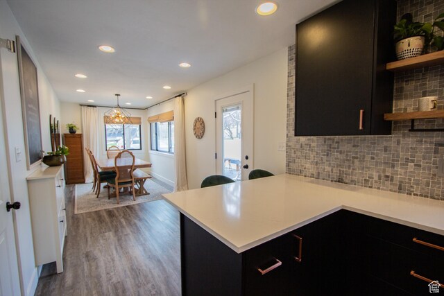 64 Winding Way, Logan, UT 84321 - kitchen with open shelves, light countertops, and dark cabinetry