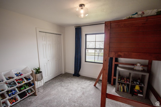64 Winding Way, Logan, UT 84321 - carpeted bedroom featuring a closet and baseboards