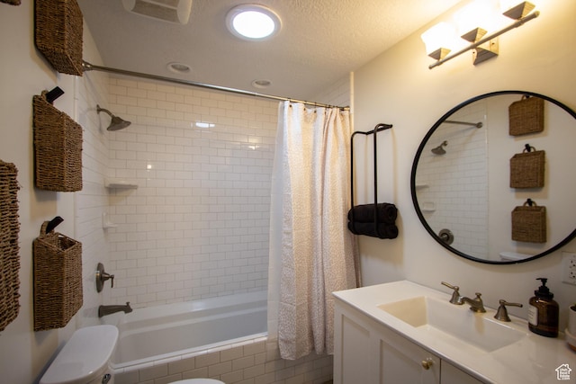 64 Winding Way, Logan, UT 84321 - full bath with a textured ceiling, tiled shower / bath, vanity, toilet, and recessed lighting