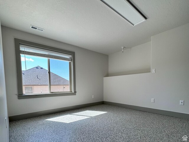 1126 E Bench View Dr N, Ogden, UT 84404 - spare room with baseboards, visible vents, and a textured ceiling