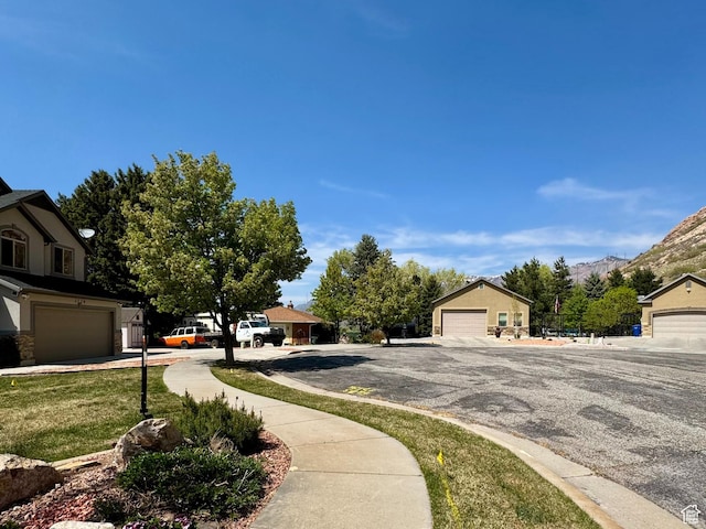 1126 E Bench View Dr N, Ogden, UT 84404 - view of road with sidewalks and a mountain view