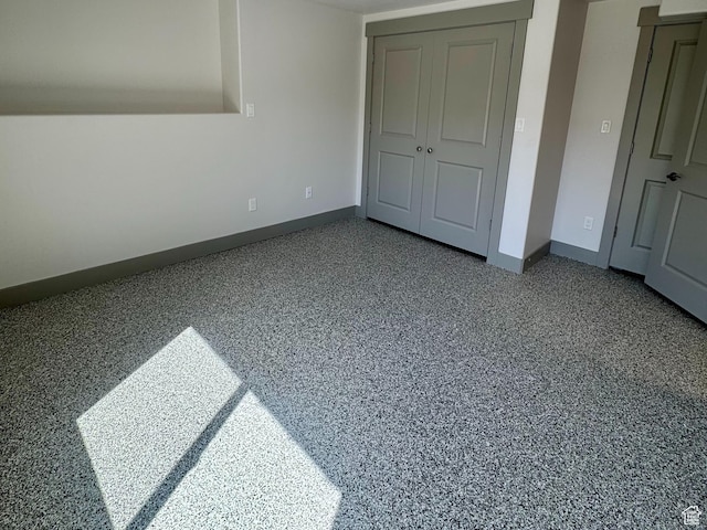 1126 E Bench View Dr N, Ogden, UT 84404 - unfurnished bedroom with speckled floor, baseboards, and a closet