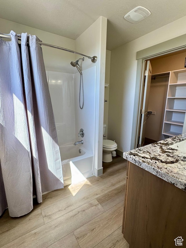 1126 E Bench View Dr N, Ogden, UT 84404 - bathroom with toilet, visible vents, wood finished floors, shower / bathtub combination with curtain, and vanity