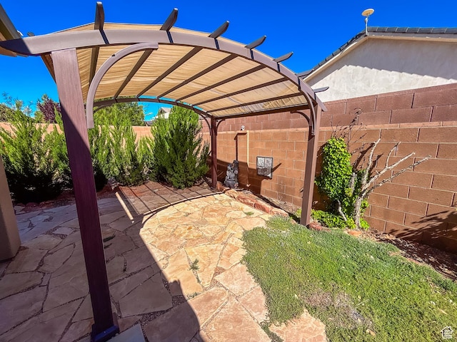 view of patio featuring a pergola and a fenced backyard