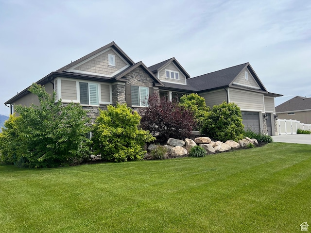 3158 S 2985 W, West Haven, UT 84401 - craftsman house featuring stone siding, a front lawn, and concrete driveway