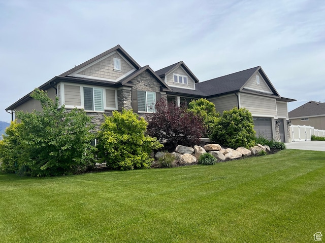 3158 S 2985 W, West Haven, UT 84401 - craftsman-style home with stone siding, a front lawn, driveway, and a garage