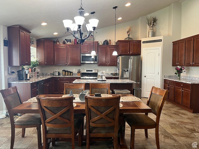 3158 S 2985 W, West Haven, UT 84401 - kitchen with stainless steel appliances, a chandelier, a center island, hanging light fixtures, and a sink