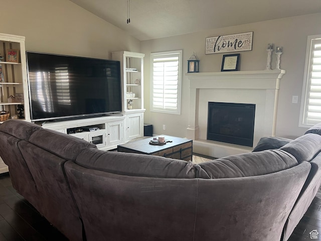3158 S 2985 W, West Haven, UT 84401 - living area with a glass covered fireplace, dark wood-style flooring, and vaulted ceiling
