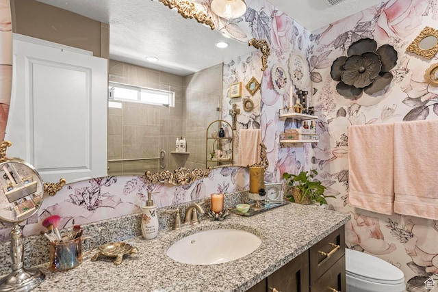 1317 N Providence Way, Tooele, UT 84074 - bathroom with a tile shower, toilet, and vanity