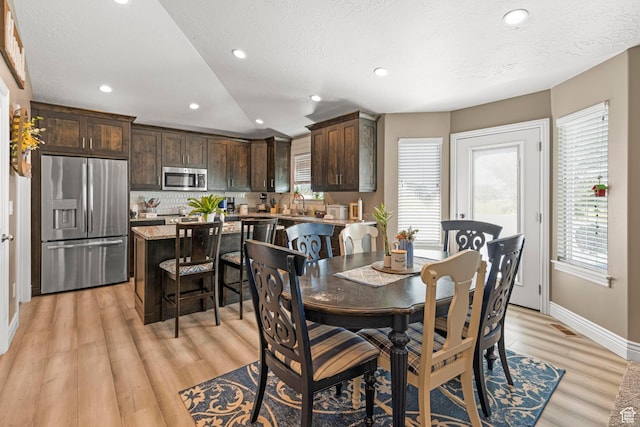 1317 N Providence Way, Tooele, UT 84074 - dining area with recessed lighting, baseboards, visible vents, and light wood-style flooring