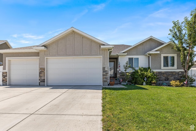 view of front of home with a front lawn, stone siding, concrete driveway, an attached garage, and board and batten siding