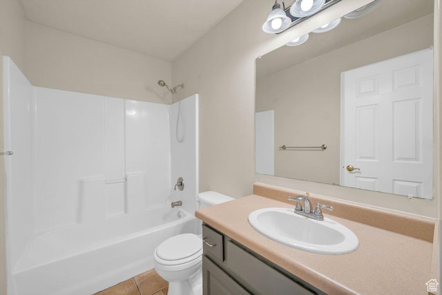 bathroom featuring tile patterned floors, vanity, tub / shower combination, and toilet