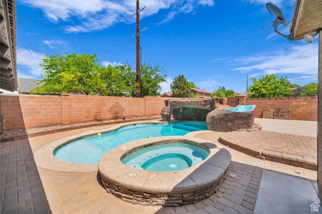 view of swimming pool with a fenced backyard, a patio, a fenced in pool, and an in ground hot tub