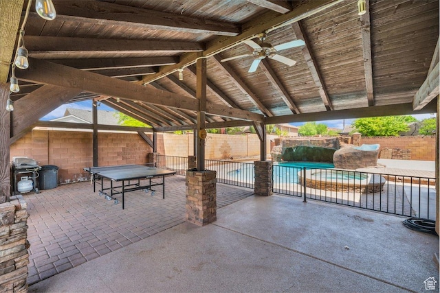 view of patio with ceiling fan, a fenced backyard, and a fenced in pool