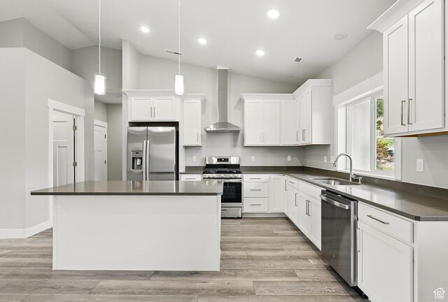 1152 E Smokey Trail Way, Cedar City, UT 84721 - kitchen with appliances with stainless steel finishes, wall chimney range hood, a sink, dark countertops, and lofted ceiling