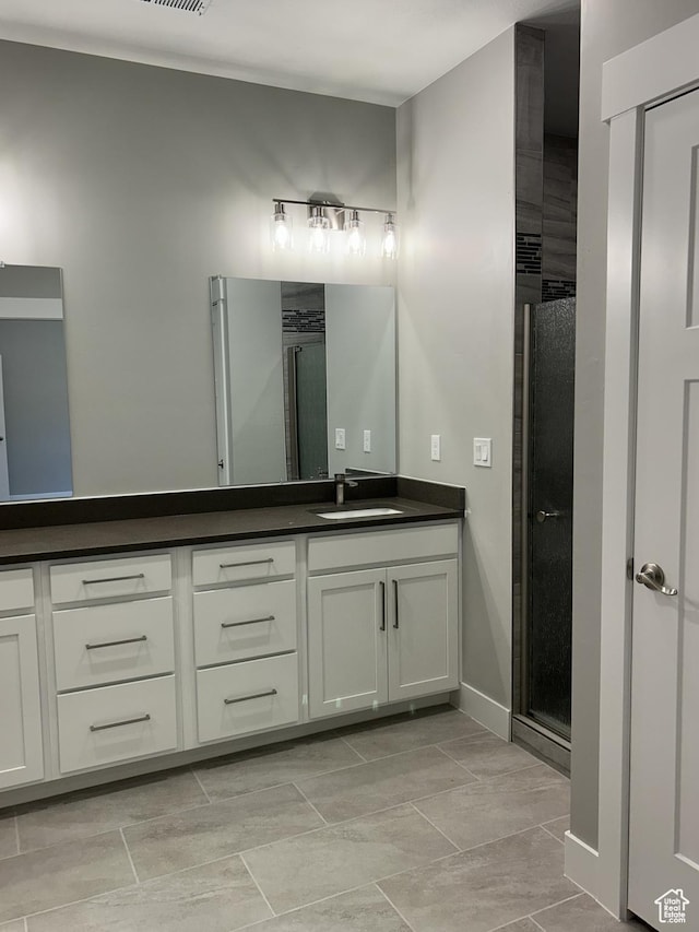 1152 E Smokey Trail Way, Cedar City, UT 84721 - full bath featuring a stall shower, double vanity, and baseboards
