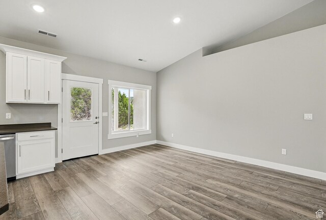 1152 E Smokey Trail Way, Cedar City, UT 84721 - unfurnished living room with lofted ceiling, wood finished floors, baseboards, and recessed lighting