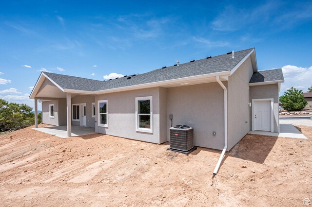 1152 E Smokey Trail Way, Cedar City, UT 84721 - rear view of house with a patio, cooling unit, stucco siding, and roof with shingles