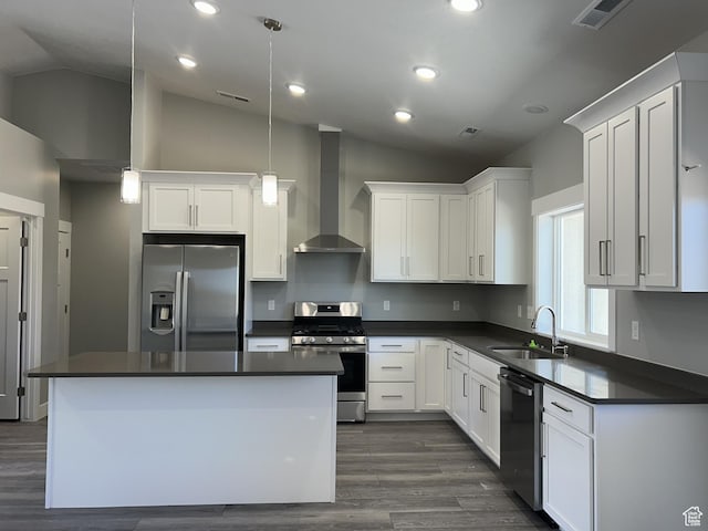 1152 E Smokey Trail Way, Cedar City, UT 84721 - kitchen with stainless steel appliances, wall chimney range hood, a sink, lofted ceiling, and dark countertops