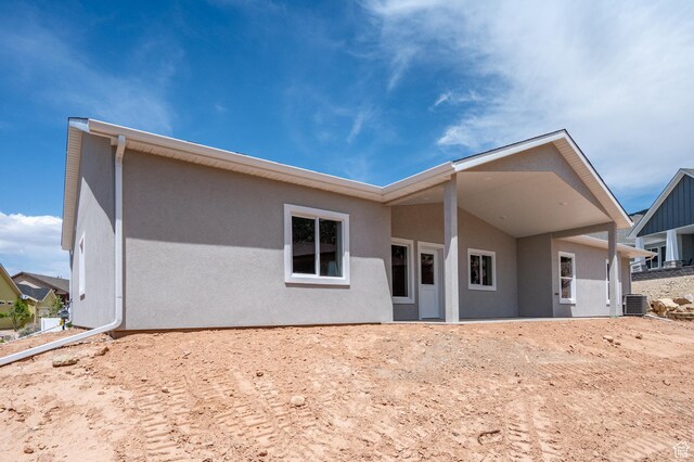1152 E Smokey Trail Way, Cedar City, UT 84721 - rear view of house featuring stucco siding and central air condition unit