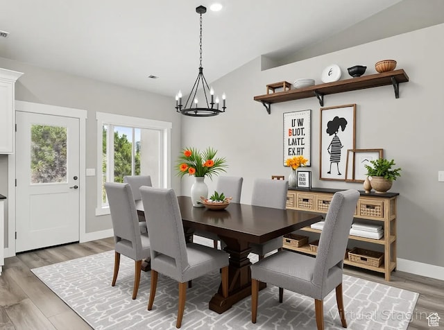 1152 E Smokey Trail Way, Cedar City, UT 84721 - dining room featuring a chandelier, light wood-type flooring, vaulted ceiling, and baseboards