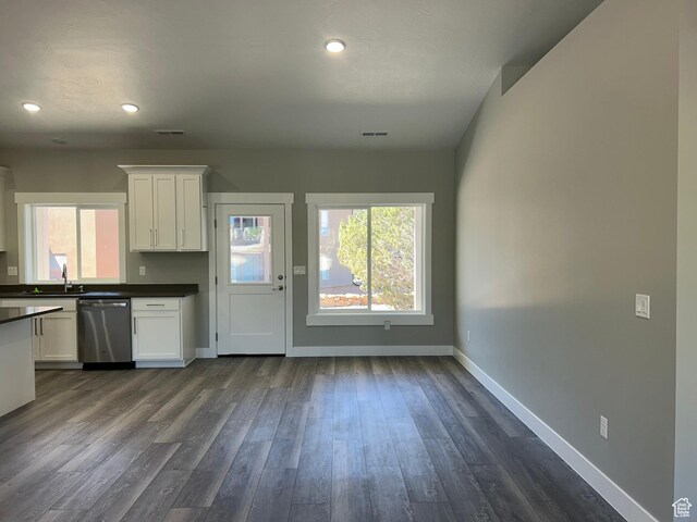 1152 E Smokey Trail Way, Cedar City, UT 84721 - kitchen with stainless steel dishwasher, dark countertops, white cabinetry, baseboards, and recessed lighting