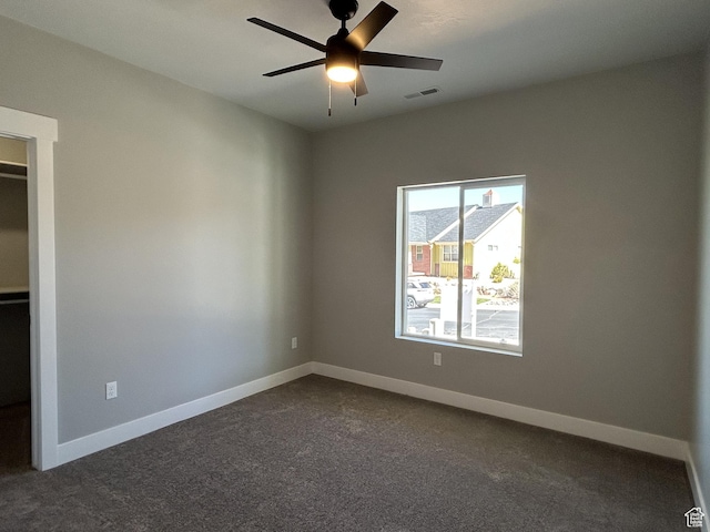1152 E Smokey Trail Way, Cedar City, UT 84721 - unfurnished room with dark carpet, ceiling fan, and baseboards