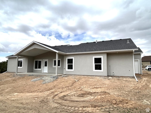 1152 E Smokey Trail Way, Cedar City, UT 84721 - back of house with stucco siding, a patio, and a shingled roof