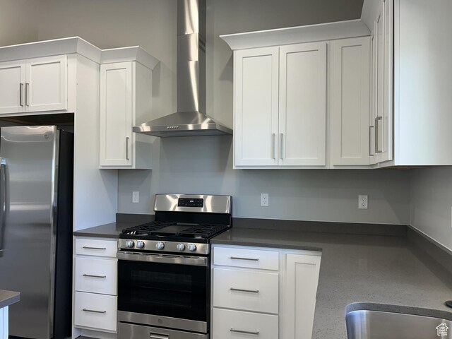 1152 E Smokey Trail Way, Cedar City, UT 84721 - kitchen with stainless steel appliances, wall chimney exhaust hood, dark countertops, and white cabinets