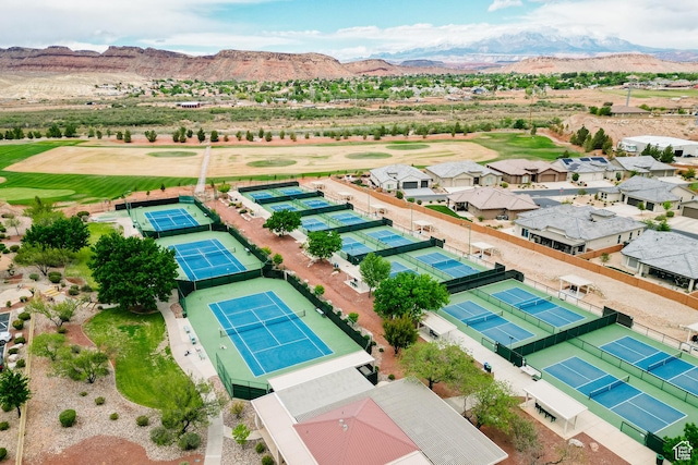 aerial view featuring a mountain view and golf course view