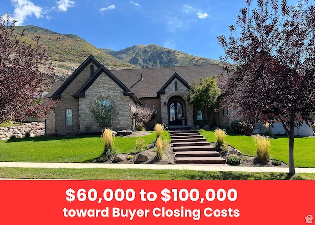 12095 S Milona Dr E, Draper, UT 84020 - view of front of home with stone siding, a mountain view, a front lawn, and french doors