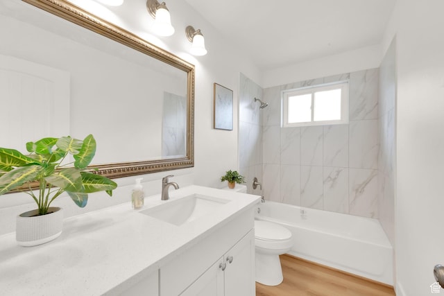 5148 W Redflower Cir, West Valley City, UT 84120 - full bath featuring toilet, vanity, wood finished floors, and bathing tub / shower combination