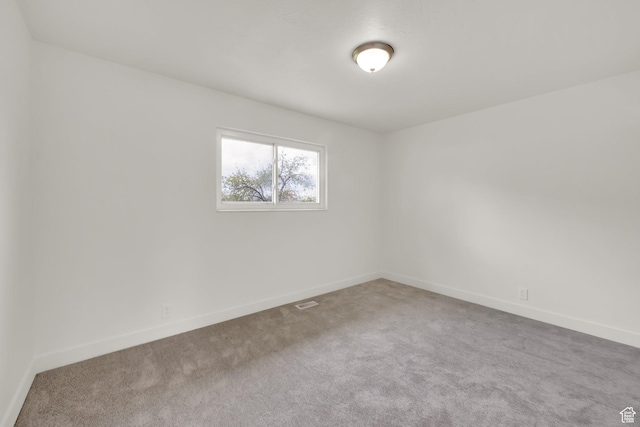 5148 W Redflower Cir, West Valley City, UT 84120 - carpeted spare room with baseboards