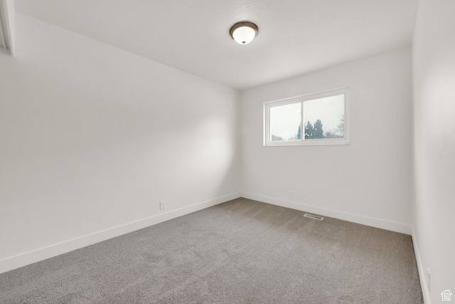 5148 W Redflower Cir, West Valley City, UT 84120 - unfurnished room with carpet, visible vents, and baseboards