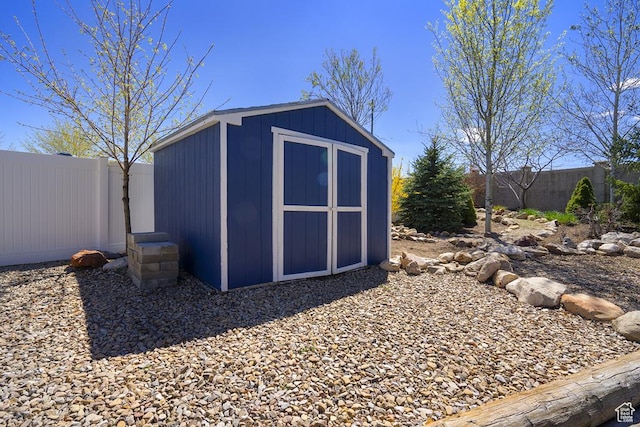 6961 W Goblin Valley Cv S, West Jordan, UT 84081 - view of shed with a fenced backyard