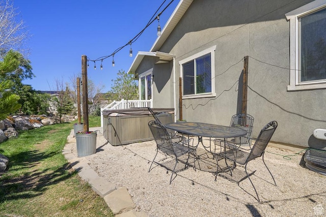 6961 W Goblin Valley Cv S, West Jordan, UT 84081 - view of patio / terrace with a hot tub and outdoor dining space