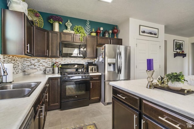 6961 W Goblin Valley Cv S, West Jordan, UT 84081 - kitchen with a sink, dark brown cabinets, decorative backsplash, light countertops, and black appliances