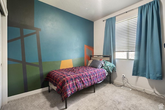 6961 W Goblin Valley Cv S, West Jordan, UT 84081 - carpeted bedroom with baseboards and a textured ceiling