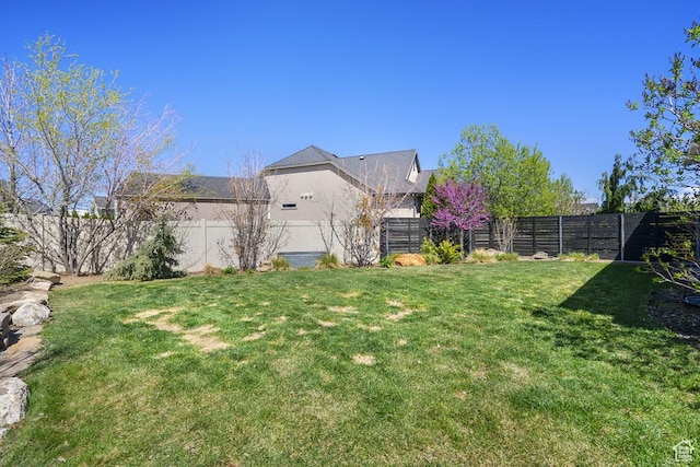 6961 W Goblin Valley Cv S, West Jordan, UT 84081 - view of yard featuring a fenced backyard