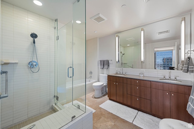 full bathroom featuring a shower stall, visible vents, toilet, and a sink