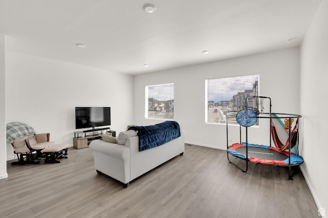 1751 E Wolverine Way, Eagle Mountain, UT 84005 - living room featuring recessed lighting, light wood-type flooring, and baseboards