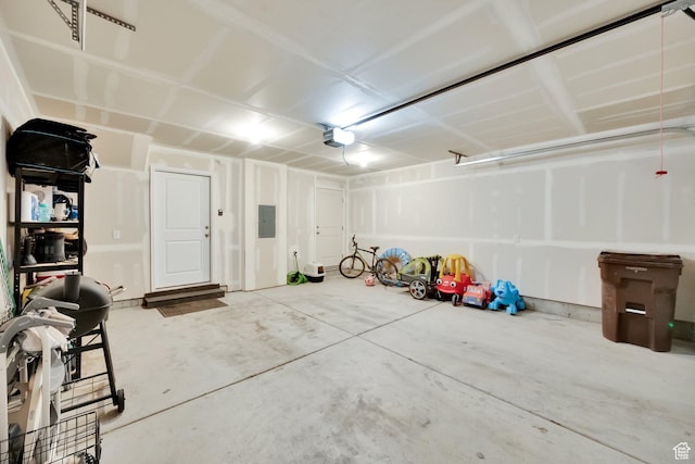 1751 E Wolverine Way, Eagle Mountain, UT 84005 - garage with electric panel and a garage door opener