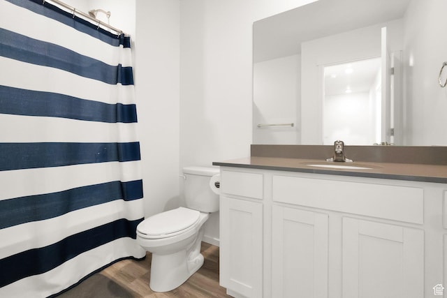 1751 E Wolverine Way, Eagle Mountain, UT 84005 - bathroom with a shower with shower curtain, wood finished floors, toilet, and vanity