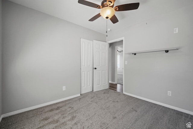 unfurnished bedroom featuring baseboards, ceiling fan, and carpet