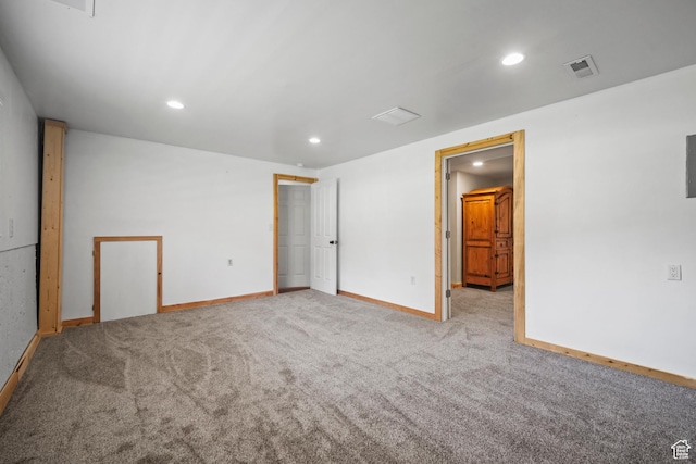 unfurnished room with recessed lighting, visible vents, carpet, and baseboards