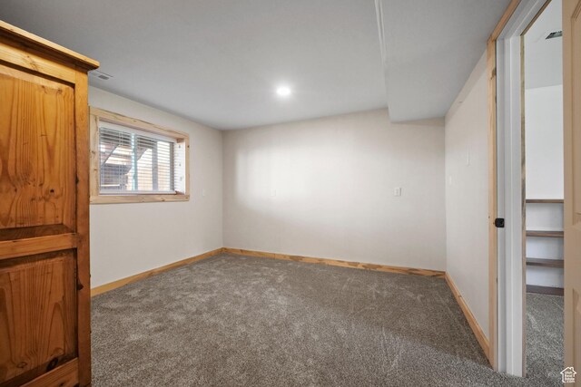 interior space featuring visible vents, baseboards, and carpet floors
