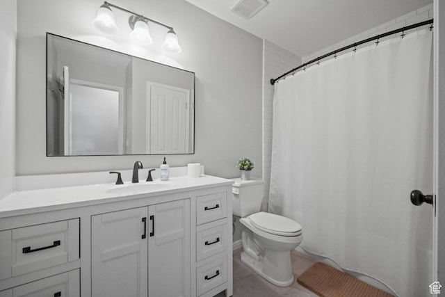 full bath with tile patterned floors, a shower with curtain, toilet, vanity, and visible vents