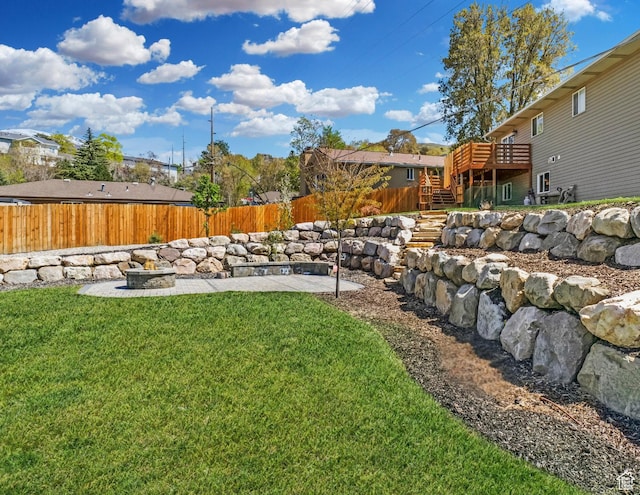 view of yard featuring stairway, a deck, a patio, and a fenced backyard