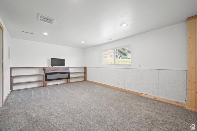 below grade area featuring recessed lighting, visible vents, carpet floors, and baseboards